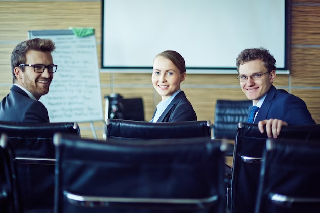 3 individuals in corporate attire