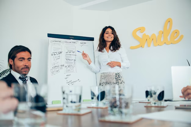 A girl says something near the board in the office